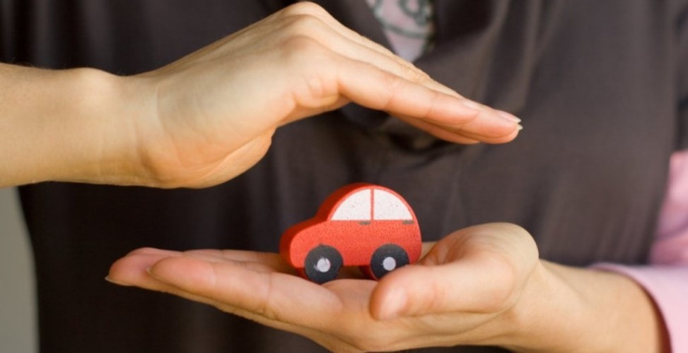 holding a toy car